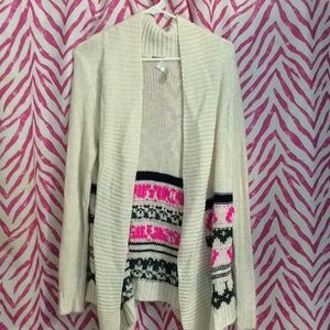Cream colored cardigan.